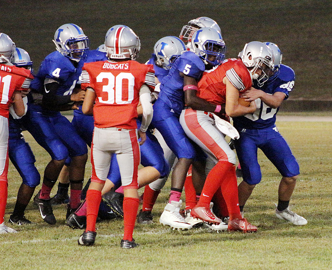 Bulldogs surround a Bobcats runner